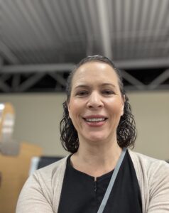 Woman excited for her solo travel adventure smiling.