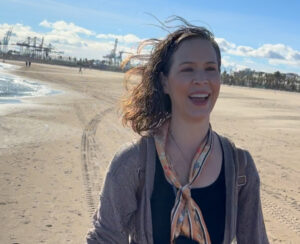 Image of the author happy next to the Mediterranean Sea for the first time