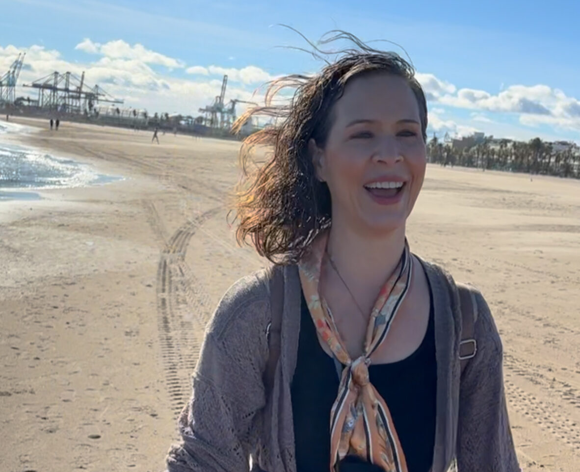 Image of the author happy next to the Mediterranean Sea for the first time